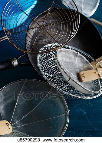 Stock Photo - Metal sieves and strainers. Fotosearch