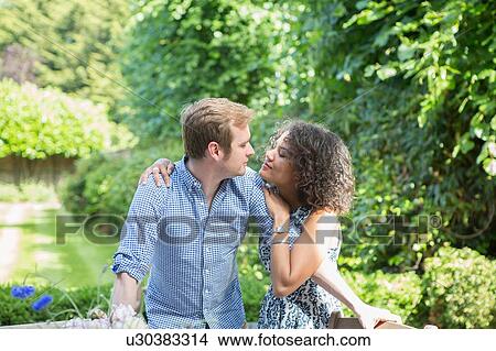 "Mid adult couple, outdoors, embracing, face to face" View Large Photo Image Picture - "Mid adult couple, outdoors, embracing, face to face". Fotosearch