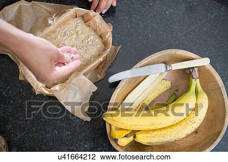"Mid adult woman making banana bread in kitchen, overhead view, focus on hands" View Large Photo Image Stock Image - "Mid adult woman making banana bread in kitchen, overhead view, focus on hands". Fotosearch