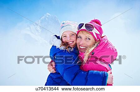 "Mother and daughter hugging, Chamonix, France" View Large Photo Image Picture - "Mother and daughter hugging, Chamonix, France". Fotosearch