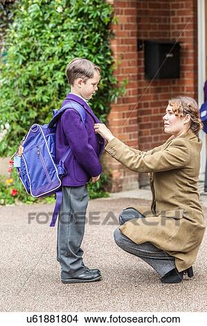 Mother getting son ready for school View Large Photo Image Picture - Mother getting son ready for school. Fotosearch