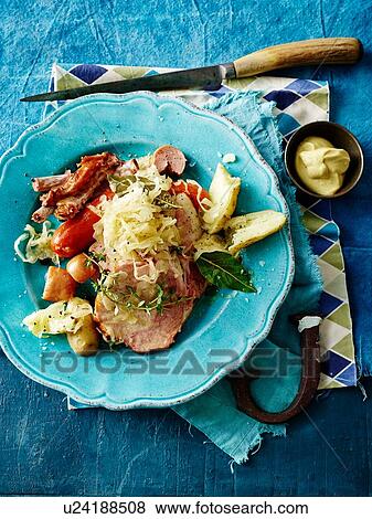 Overhead view of choucroute garnie in blue bowl View Large Photo Image Stock Photo - Overhead view of choucroute garnie in blue bowl. Fotosearch