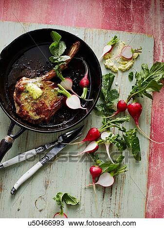Overhead view of pan fired caramalised chop with herb butter and radishes View Large Photo Image Stock Image - Overhead view of pan fired caramalised chop with herb butter and radishes. Fotosearch