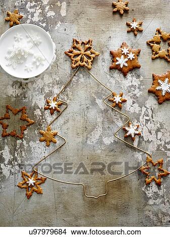 Picture - "Overhead view of Pernik, star shaped gingerbread cookies with snowflake icing". Fotosearch