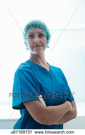 Portrait of confident female surgeon wearing surgical scrubs View Large Photo Image Stock Photo - Portrait of confident female surgeon wearing surgical scrubs. Fotosearch