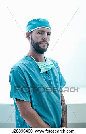 Portrait of confident male surgeon wearing surgical scrubs View Large Photo Image Stock Image - Portrait of confident male surgeon wearing surgical scrubs. Fotosearch