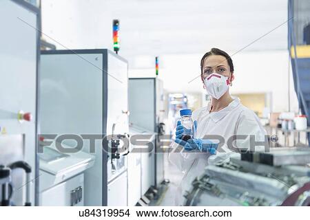 Portrait of female scientist holding graphene nano-platelets sample in graphene processing factory View Large Photo Image Picture - Portrait of female scientist holding graphene nano-platelets sample in graphene processing factory. Fotosearch