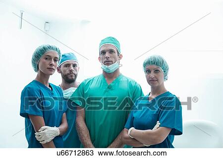 Portrait of four surgeons wearing surgical scrubs View Large Photo Image Stock Image - Portrait of four surgeons wearing surgical scrubs. Fotosearch
