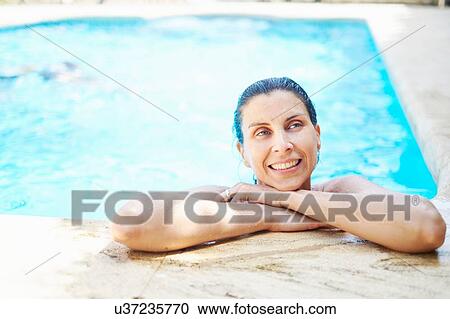 Portrait of mature woman with wet hair in swimming pool View Large Photo Image Stock Image - Portrait of mature woman with wet hair in swimming pool. Fotosearch