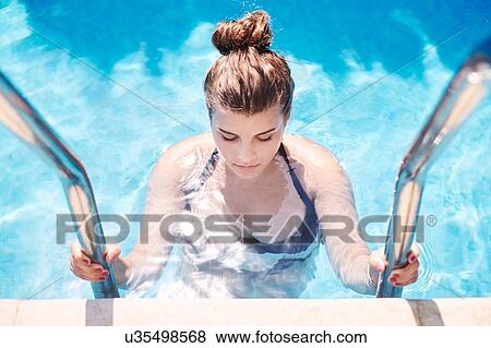 Portrait of teenage girl in swimming pool View Large Photo Image Stock Photo - Portrait of teenage girl in swimming pool. Fotosearch