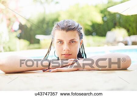Portrait of teenage girl with wet hair in swimming pool View Large Photo Image Stock Photo - Portrait of teenage girl with wet hair in swimming pool. Fotosearch