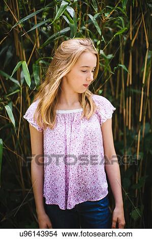 "Portrait of young girl, outdoors, looking away" View Large Photo Image Picture - "Portrait of young girl, outdoors, looking away". Fotosearch