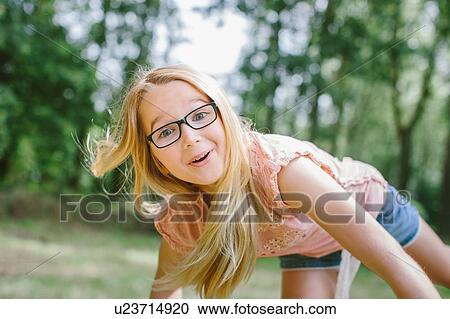"Portrait of young girl, outdoors, smiling" View Large Photo Image Stock Image - "Portrait of young girl, outdoors, smiling". Fotosearch
