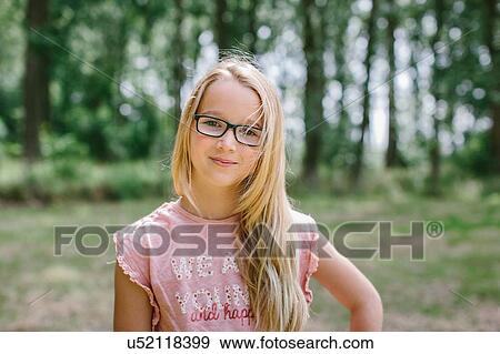 "Portrait of young girl, outdoors, smiling" View Large Photo Image Stock Photo - "Portrait of young girl, outdoors, smiling". Fotosearch