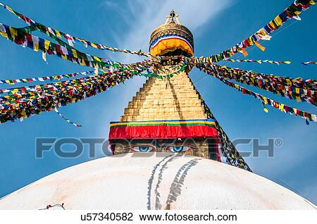Stock Image - "Prayer Flags at Boudhanath stupa in Kathmandu, Nepal". Fotosearch