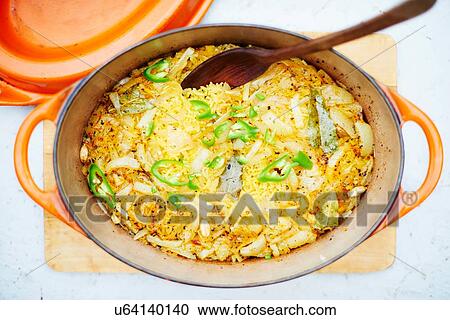 Stock Image - "Rice in cast iron dish, close-up". Fotosearch
