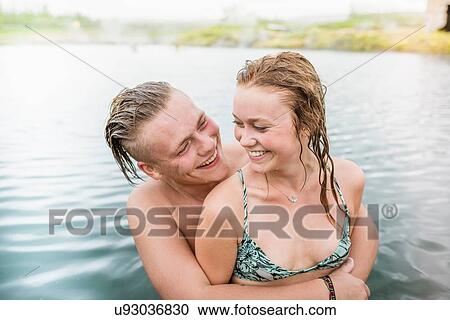 "Romantic young couple in Secret Lagoon hot spring (Gamla Laugin), Fludir, Iceland" View Large Photo Image Stock Image - "Romantic young couple in Secret Lagoon hot spring (Gamla Laugin), Fludir, Iceland". Fotosearch