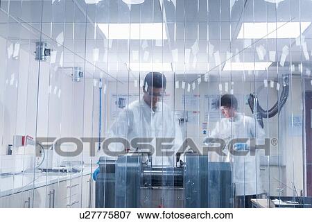 Scientist manufacturing graphene ink in graphene processing factory View Large Photo Image Stock Photo - Scientist manufacturing graphene ink in graphene processing factory. Fotosearch