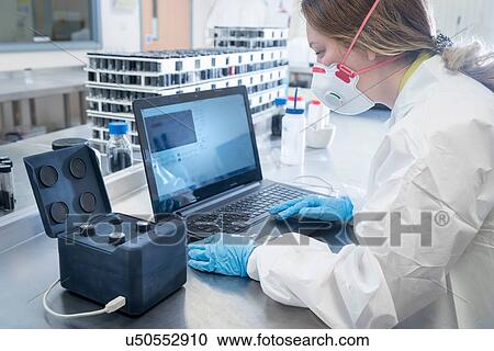 Scientist with dispersion analysis machine in graphene processing factory View Large Photo Image Stock Image - Scientist with dispersion analysis machine in graphene processing factory. Fotosearch