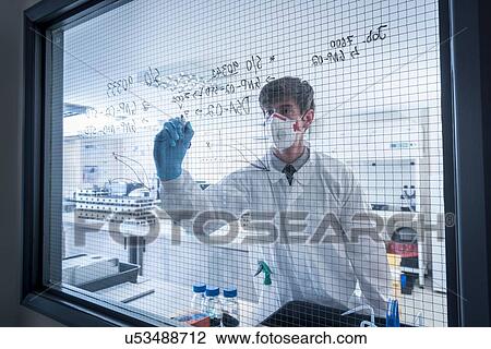 Scientist writing formulae on window of laboratory in graphene processing factory View Large Photo Image Stock Image - Scientist writing formulae on window of laboratory in graphene processing factory. Fotosearch