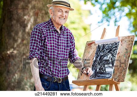 "Senior man drawing in park, Hackney, London" View Large Photo Image Stock Image - "Senior man drawing in park, Hackney, London". Fotosearch
