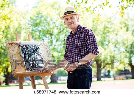 "Senior man drawing in park, Hackney, London" View Large Photo Image Stock Photo - "Senior man drawing in park, Hackney, London". Fotosearch