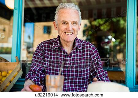 Senior man relaxing at cafe View Large Photo Image Picture - Senior man relaxing at cafe. Fotosearch