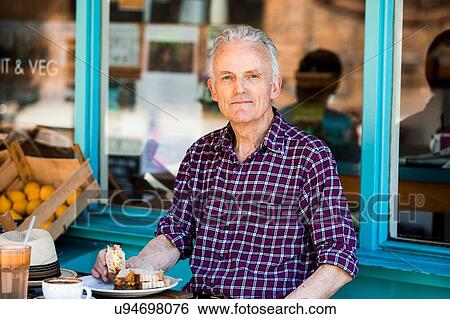 Senior man relaxing at cafe View Large Photo Image Stock Photograph - Senior man relaxing at cafe. Fotosearch