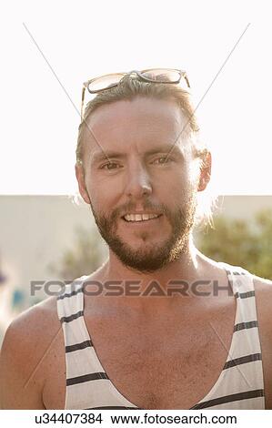 Sunlit portrait of mid adult man with beard View Large Photo Image Picture - Sunlit portrait of mid adult man with beard. Fotosearch