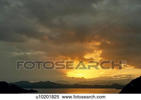 "Sunrise over silhouetted mountains and Lugu Lake, Yunnan, China" View Large Photo Image Stock Photography - "Sunrise over silhouetted mountains and Lugu Lake, Yunnan, China". Fotosearch