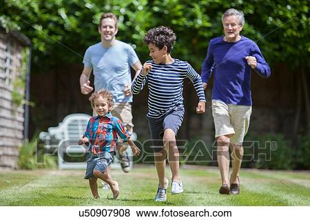 Three generation family fooling around in garden View Large Photo Image Stock Photo - Three generation family fooling around in garden. Fotosearch