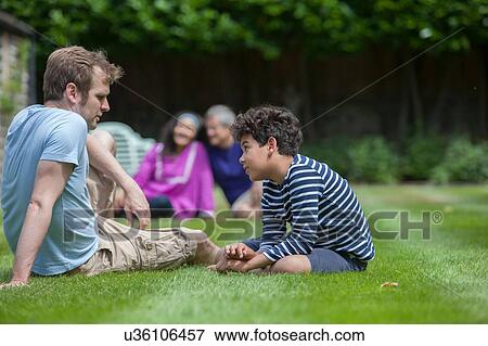 Stock Photo - Three generation family in garden. Fotosearch