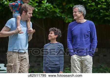 Three generation family in garden View Large Photo Image Stock Photography - Three generation family in garden. Fotosearch