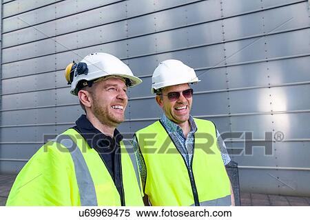 Two engineers talking at geothermal power station View Large Photo Image Stock Photography - Two engineers talking at geothermal power station. Fotosearch