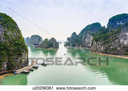 Stock Image - "View of boats and rock formation islands, Ha Long Bay, Vietnam". Fotosearch