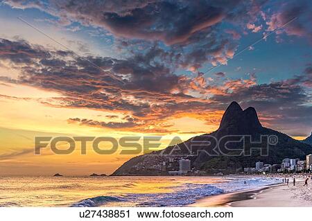 "View of Ipanema Beach and Padre Dois Irmaos against dramatic sky, Rio De Janerio, Brazil" View Large Photo Image Stock Image - "View of Ipanema Beach and Padre Dois Irmaos against dramatic sky, Rio De Janerio, Brazil". Fotosearch