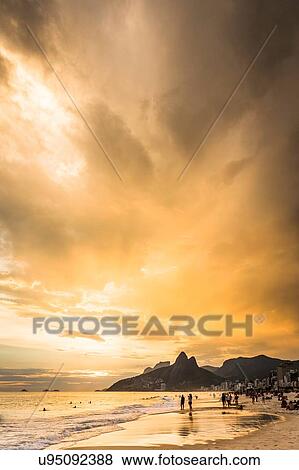 "View of Ipanema Beach and Padre Dois Irmaos against dramatic sky, Rio De Janerio, Brazil" View Large Photo Image Stock Photo - "View of Ipanema Beach and Padre Dois Irmaos against dramatic sky, Rio De Janerio, Brazil". Fotosearch
