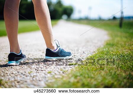 "Young girl in park, standing on pathway, preparing to run, low section" View Large Photo Image Stock Image - "Young girl in park, standing on pathway, preparing to run, low section". Fotosearch
