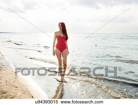 Young woman in bikini on beach View Large Photo Image Stock Photography - Young woman in bikini on beach. Fotosearch