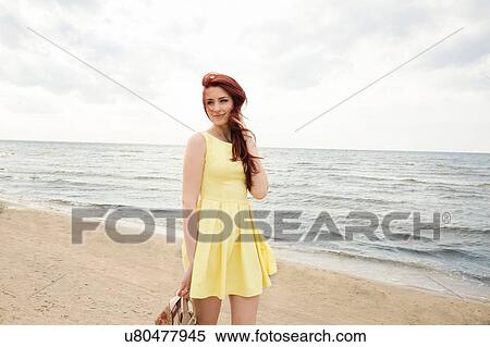 Young woman on beach View Large Photo Image Stock Photography - Young woman on beach. Fotosearch