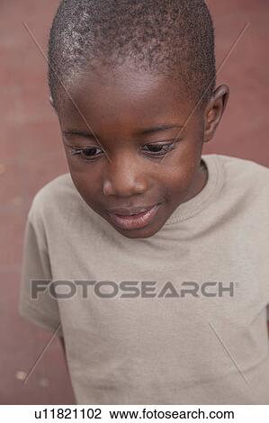 African boy concentrated View Large Photo Image Stock Image - African boy concentrated. Fotosearch