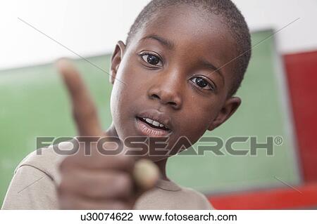 African boy doing funny face View Large Photo Image Stock Image - African boy doing funny face. Fotosearch