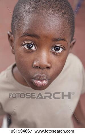 African boy giving a kiss View Large Photo Image Stock Photo - African boy giving a kiss. Fotosearch