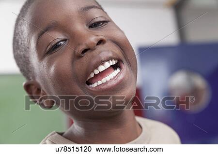 Stock Image - African boy laughing. Fotosearch