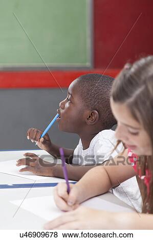Stock Photo - African boy thinking. Fotosearch