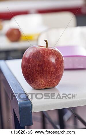 An apple on the desk View Large Photo Image Stock Image - An apple on the desk. Fotosearch