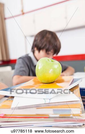 apple on books View Large Photo Image Stock Photo - apple on books. Fotosearch