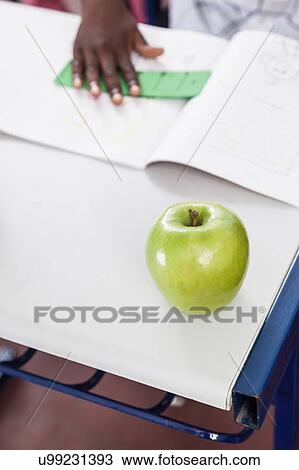 apple on desk View Large Photo Image Stock Image - apple on desk. Fotosearch