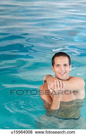 Stock Photo - Athletic guy inside the pool. Fotosearch