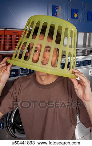 Stock Image - Basket on his head. Fotosearch